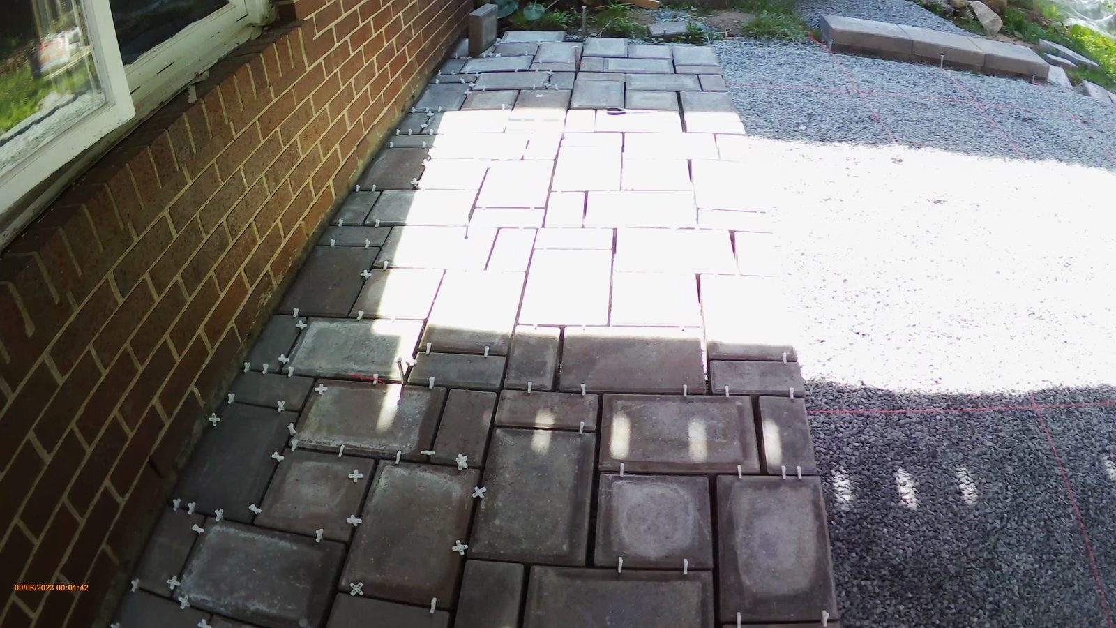 Large area of pavers laid under the deck